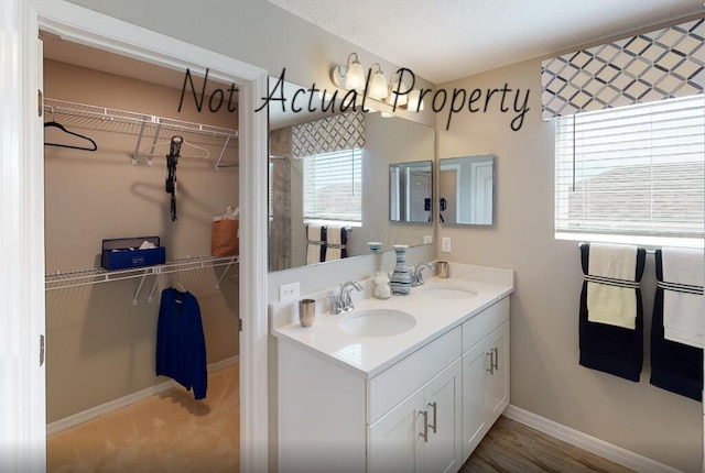 bathroom featuring vanity and a textured ceiling