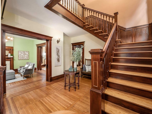 staircase with hardwood / wood-style floors