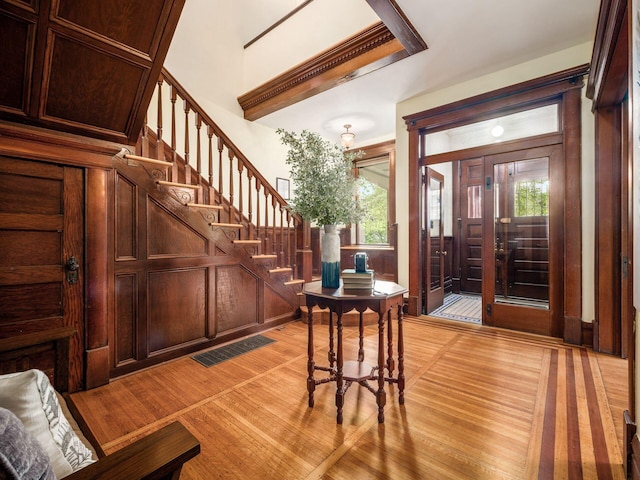 foyer entrance with a healthy amount of sunlight and light wood-type flooring