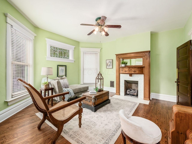 43 Winner Ave, Columbus, OH 43203 - living area with ceiling fan, dark wood-type flooring, and a fireplace with flush hearth