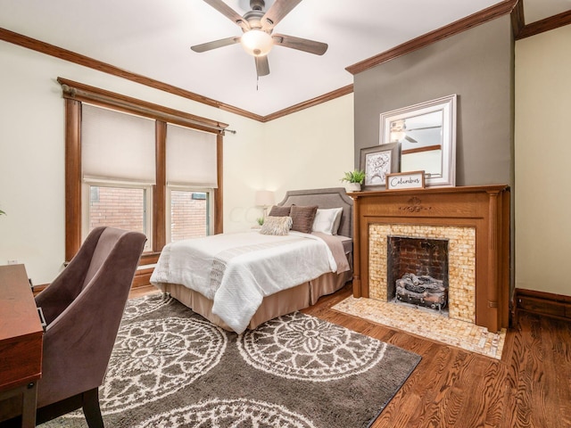 bedroom with dark hardwood / wood-style floors, ceiling fan, and ornamental molding