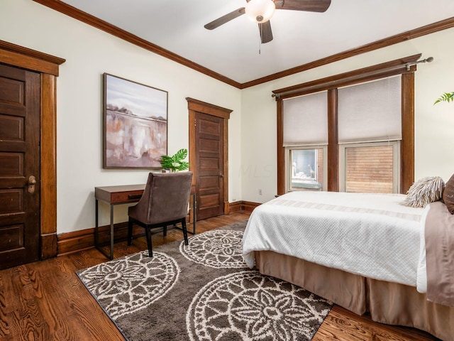 bedroom with ornamental molding, ceiling fan, and dark wood-type flooring