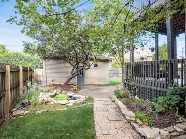 43 Winner Ave, Columbus, OH 43203 - fenced backyard featuring a wooden deck and an outbuilding