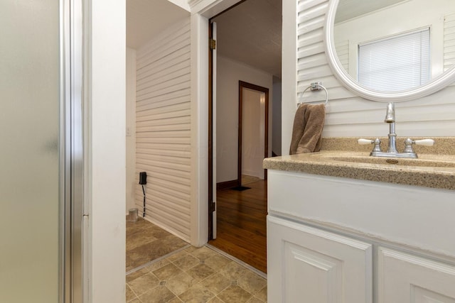 bathroom featuring vanity and hardwood / wood-style flooring