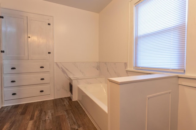 clothes washing area featuring dark hardwood / wood-style flooring