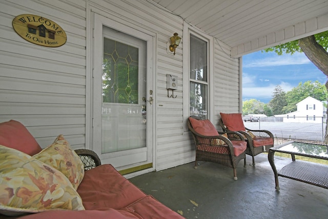 entrance to property featuring a patio