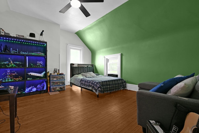 bedroom with hardwood / wood-style flooring, ceiling fan, and lofted ceiling