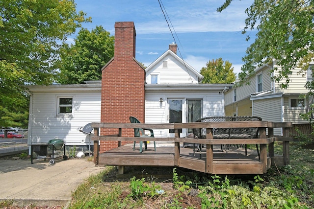 rear view of property with a deck