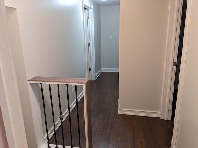 hallway with dark hardwood / wood-style floors