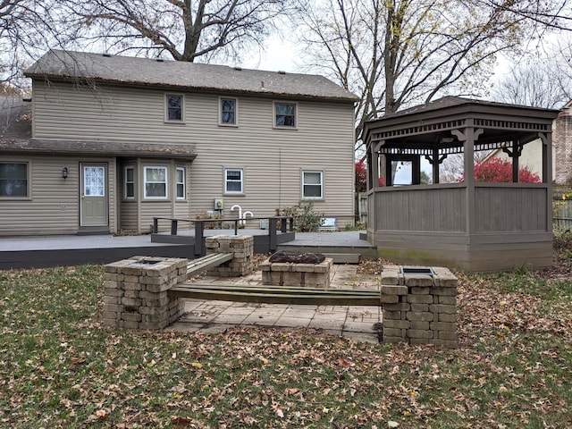 rear view of property with a gazebo and a patio area