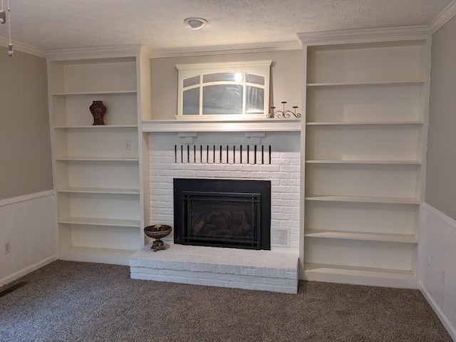 unfurnished living room with a brick fireplace, crown molding, carpet floors, and a textured ceiling