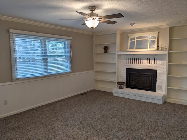 unfurnished living room with ornamental molding, a fireplace, carpet, and a textured ceiling