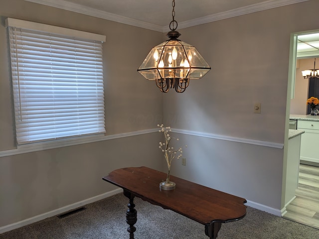 unfurnished dining area with an inviting chandelier, crown molding, and carpet