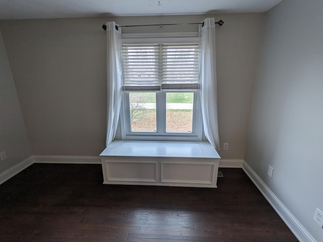 spare room featuring dark hardwood / wood-style floors