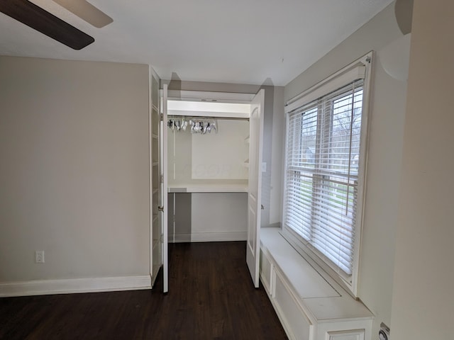 hallway with dark wood-type flooring