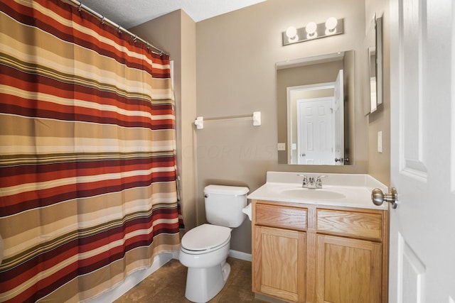 bathroom with vanity, tile patterned floors, toilet, a textured ceiling, and curtained shower