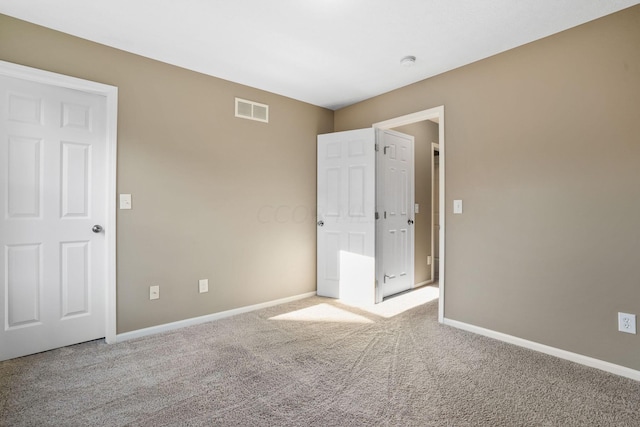 unfurnished bedroom featuring light colored carpet