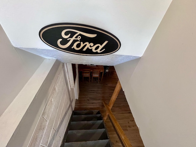 stairway with hardwood / wood-style floors