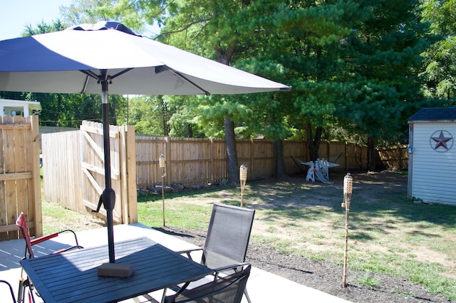 view of patio / terrace with a storage shed