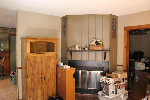 kitchen featuring tile patterned floors and a fireplace