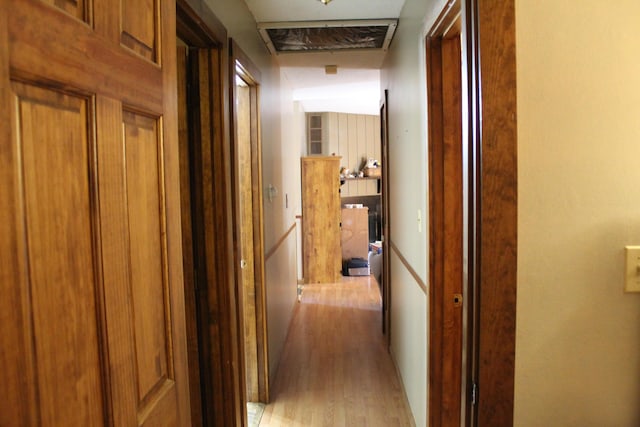 corridor with light wood-type flooring