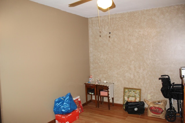 miscellaneous room with hardwood / wood-style flooring and ceiling fan