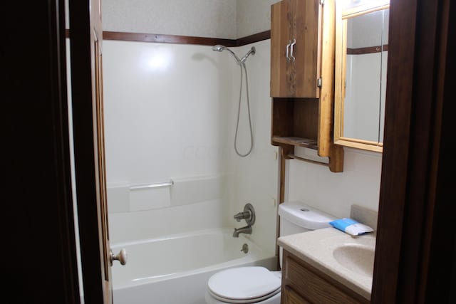 full bathroom with shower / bathing tub combination, vanity, and toilet