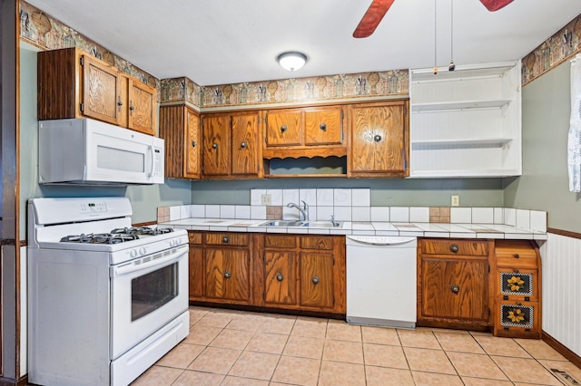 5010 Chipman Dr, Columbus, OH 43232 - kitchen featuring white appliances, a sink, brown cabinetry, and tile counters