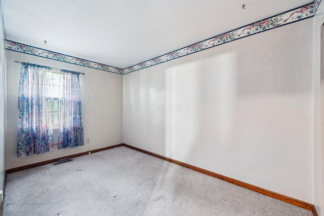 5010 Chipman Dr, Columbus, OH 43232 - empty room featuring carpet floors and baseboards