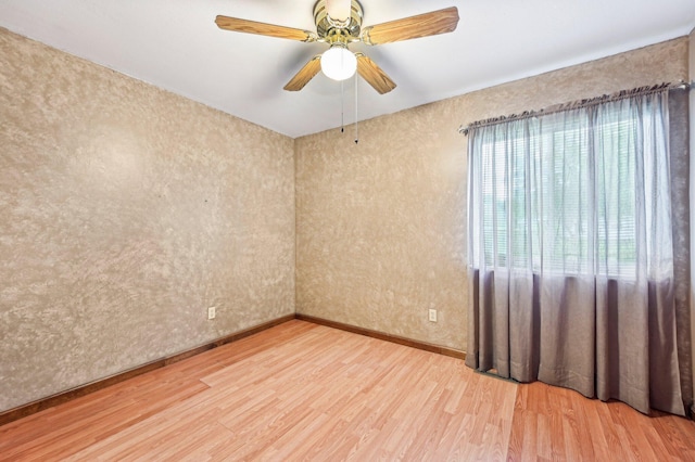 5010 Chipman Dr, Columbus, OH 43232 - spare room featuring wood finished floors, a ceiling fan, and baseboards