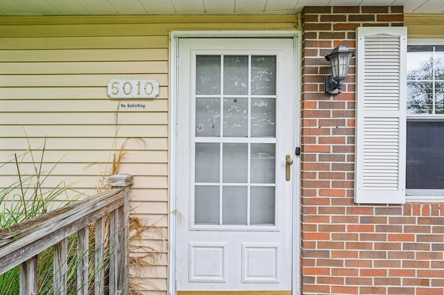 5010 Chipman Dr, Columbus, OH 43232 - doorway to property featuring brick siding