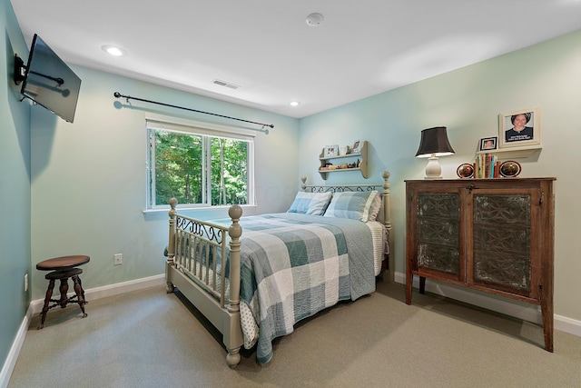 bedroom with visible vents, carpet, and baseboards