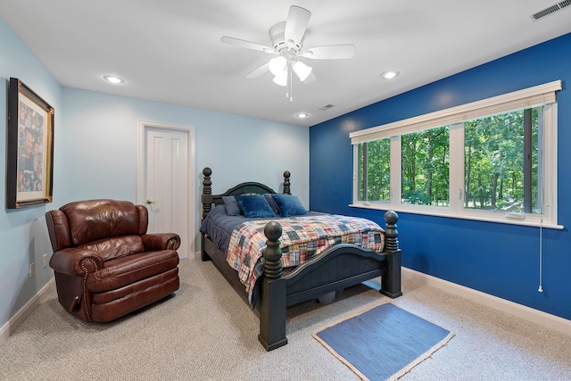 carpeted bedroom featuring recessed lighting, baseboards, and visible vents