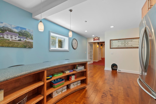 interior space with open shelves, dark wood-style floors, freestanding refrigerator, recessed lighting, and pendant lighting