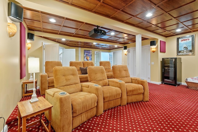 cinema featuring carpet floors, beverage cooler, baseboards, recessed lighting, and wooden ceiling