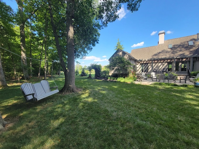 view of yard featuring a patio and a pergola