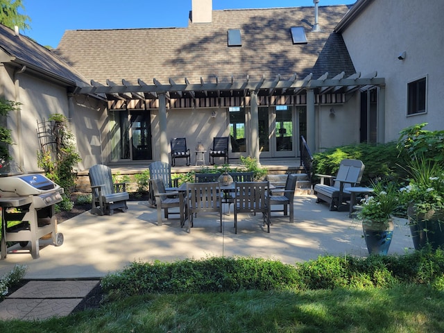 view of patio / terrace with a pergola, grilling area, and outdoor dining space