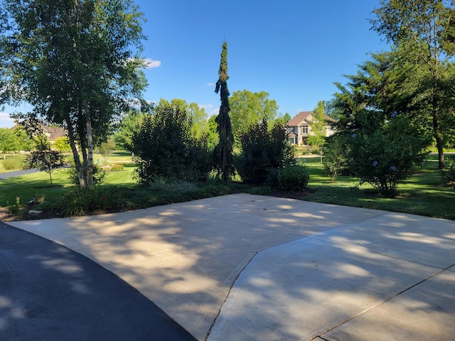 view of basketball court featuring a yard