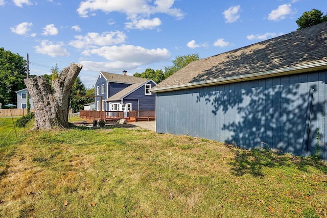 view of yard featuring a wooden deck