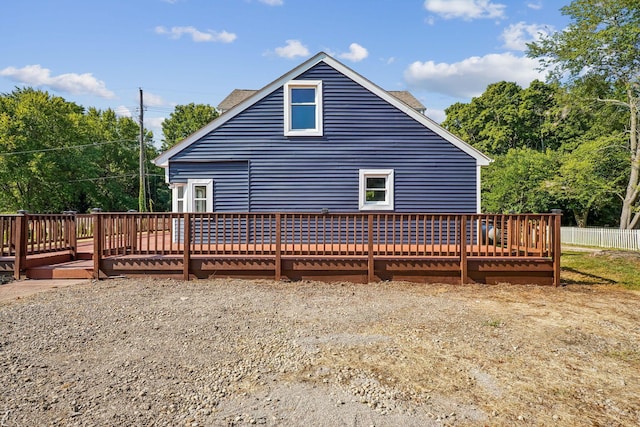 rear view of house featuring a deck