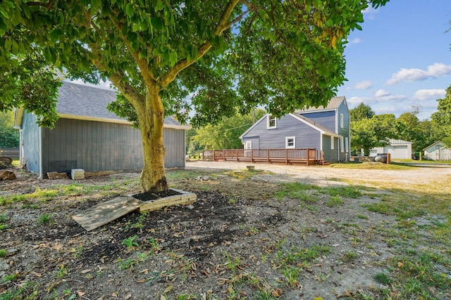 view of yard featuring a wooden deck