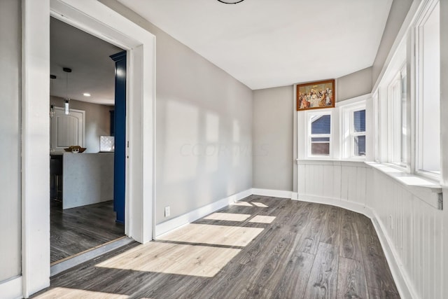 unfurnished room featuring hardwood / wood-style flooring