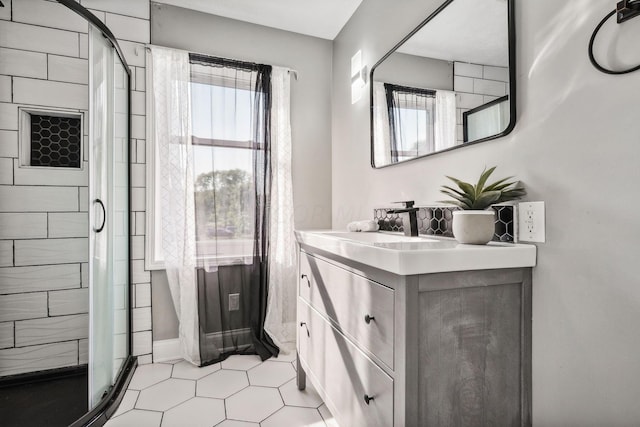 bathroom with vanity and an enclosed shower