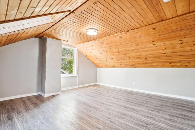 bonus room featuring hardwood / wood-style floors, wood ceiling, and vaulted ceiling