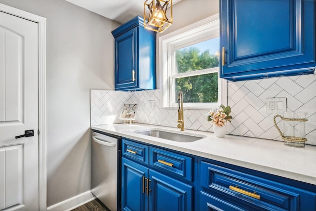 kitchen featuring decorative backsplash, blue cabinets, sink, dishwasher, and dark hardwood / wood-style floors