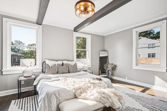 bedroom with beam ceiling, crown molding, and dark wood-type flooring