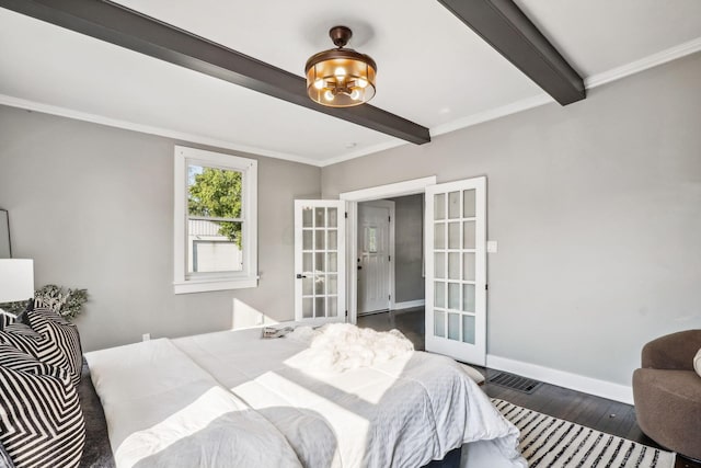 bedroom featuring beam ceiling, french doors, dark wood-type flooring, and ornamental molding