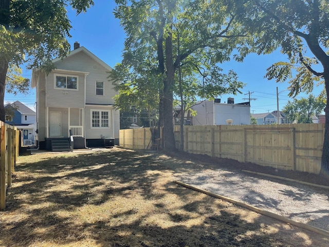 rear view of property with central air condition unit