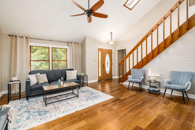 living room featuring dark hardwood / wood-style floors and ceiling fan