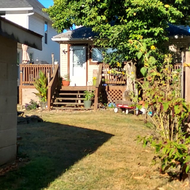 view of yard with a wooden deck